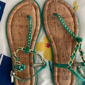 Cushioned soles, cork look bottoms, sandals.